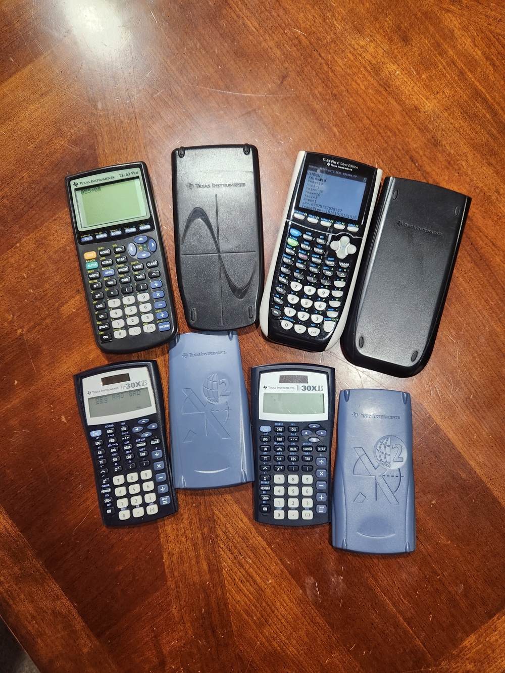4 Texas Instruments Black and Blue Scientific Calculators Bundle